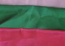 Folded green and pink fabric samples