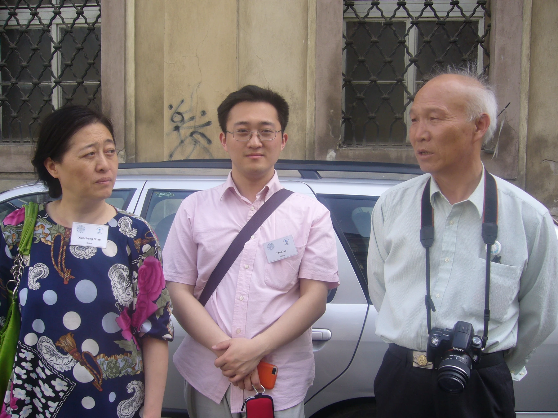 Shao Xiaocheng and Yao Xiao wearing readable IOV name badges outdoors in Prague, April 2012.